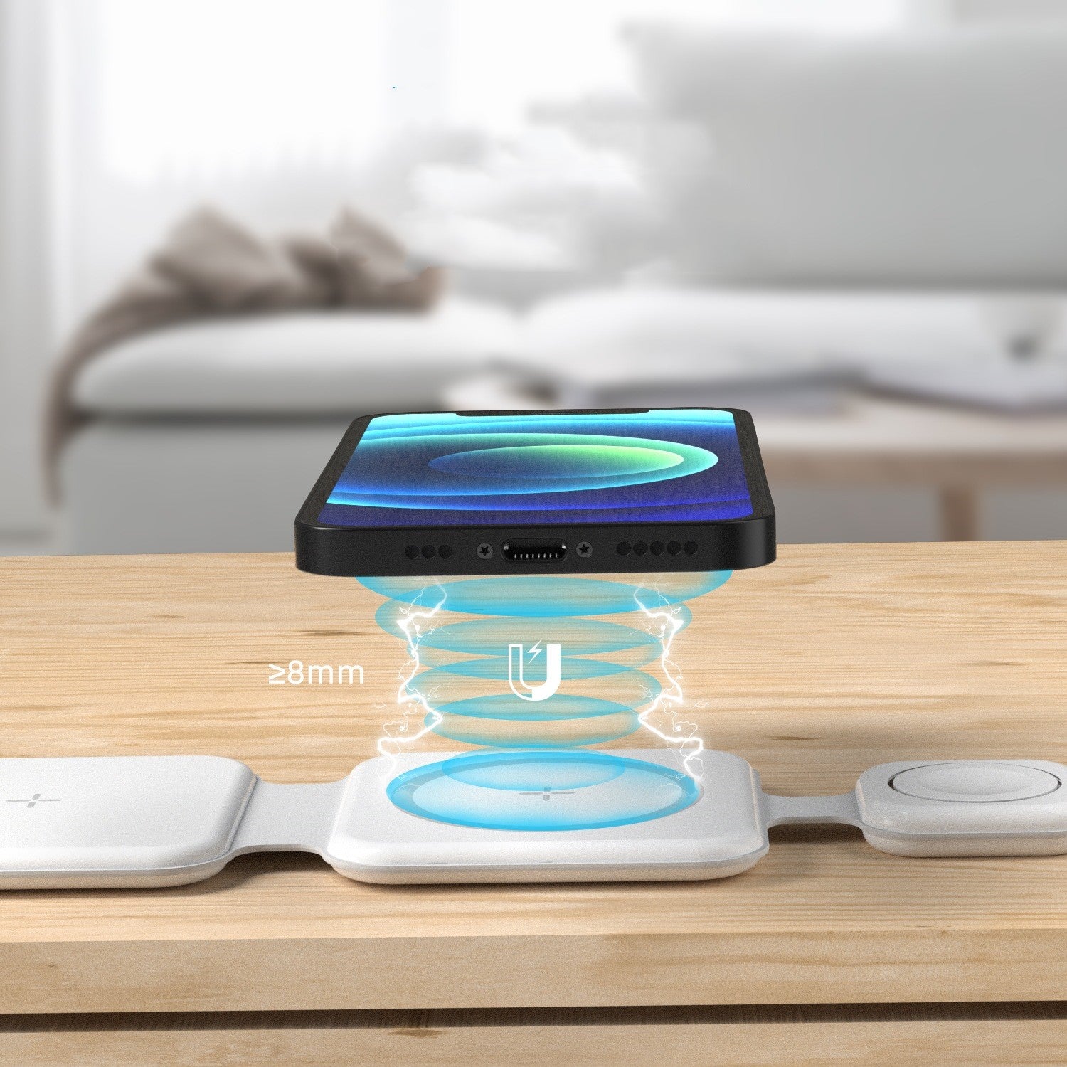 Wireless charging pad with smartphone on a wooden surface