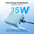 A cyan 35W fast charging power bank with two USB-C ports, one of which is plugged in, shown on a blue gradient background with promotional text.