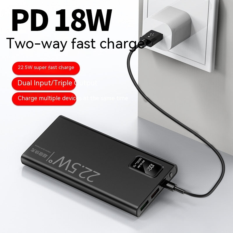 Black power bank with USB cable plugged into a wall outlet, featuring text about PD 18W fast charging.
