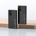 Two black power banks with digital displays on a light gray background