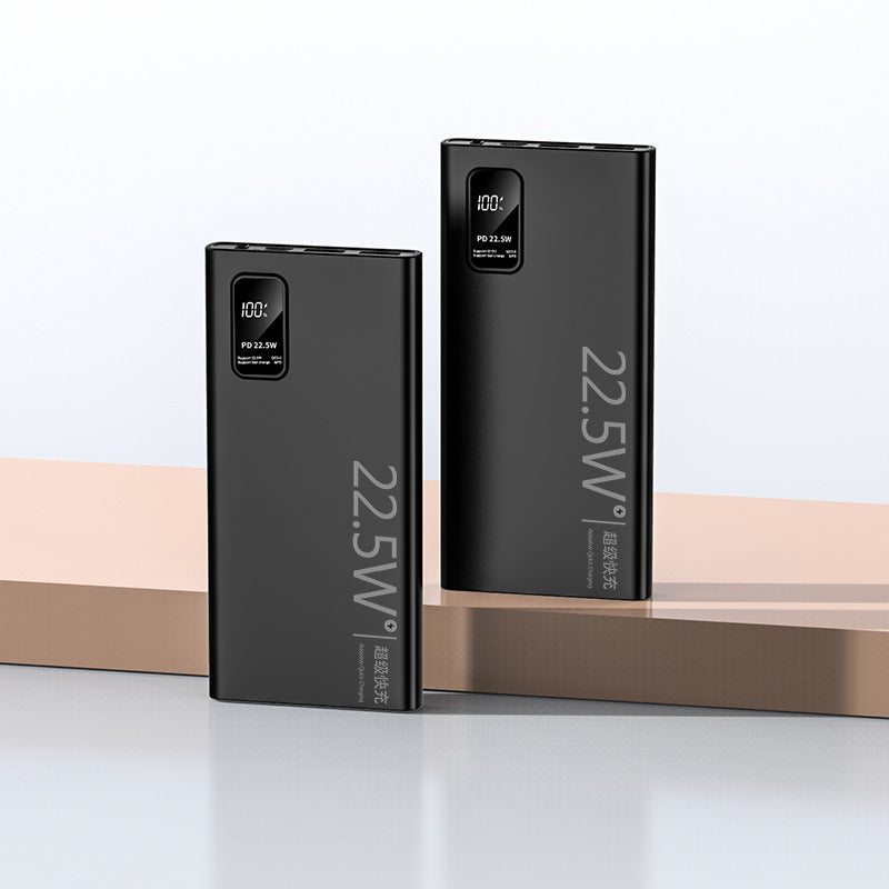 Two black power banks with digital displays on a light gray background