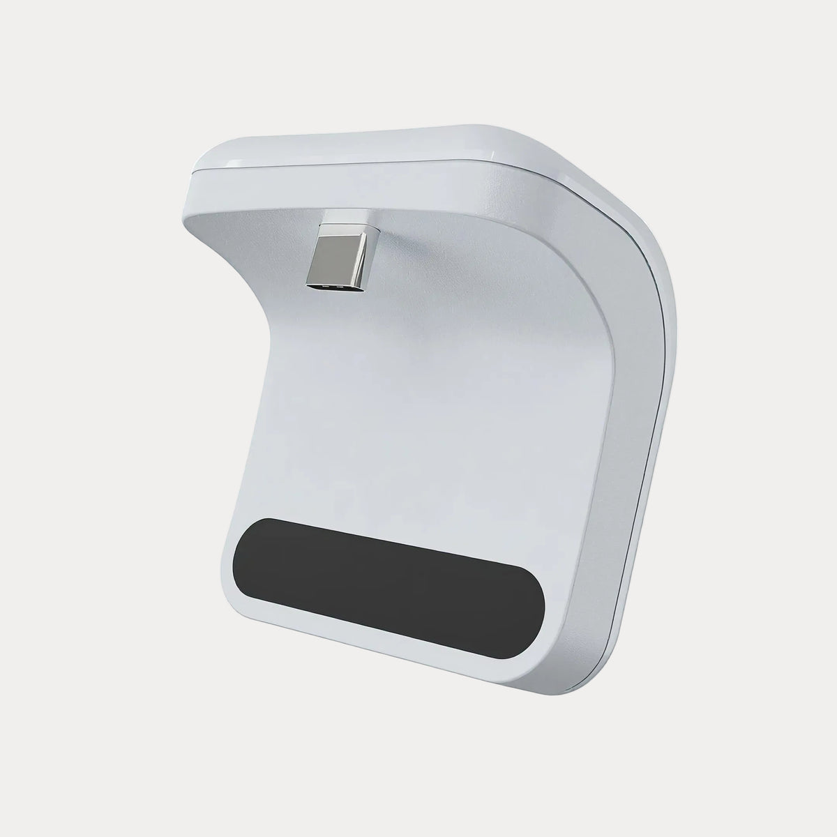 A PS5 controller power bank on a light gray backround.