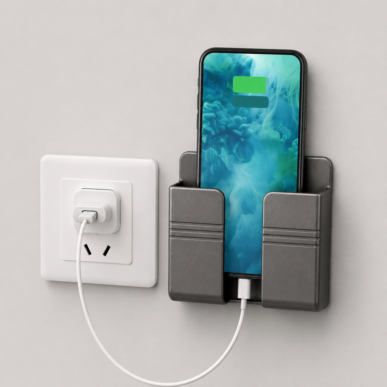 Space gray phone holder with smartphone and power adapter on a light gray background