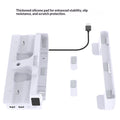 White electronic charging dock with thickened silicone pads and a black charging cable, shown on a white background with a text callout explaining the stability and scratch protection benefits.