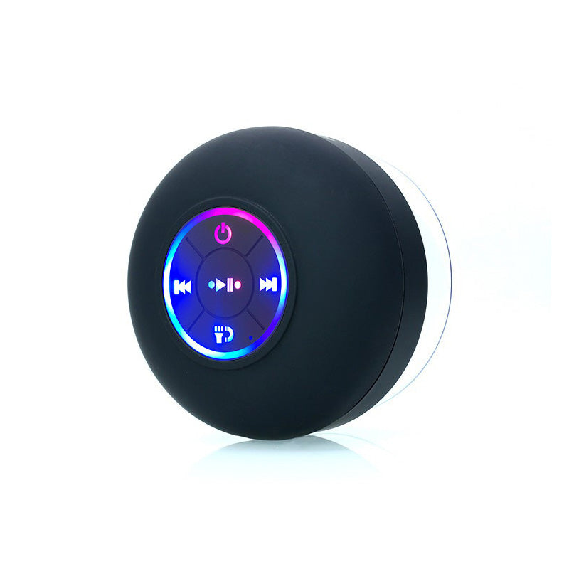 Black spherical Bluetooth speaker with control buttons on a white background