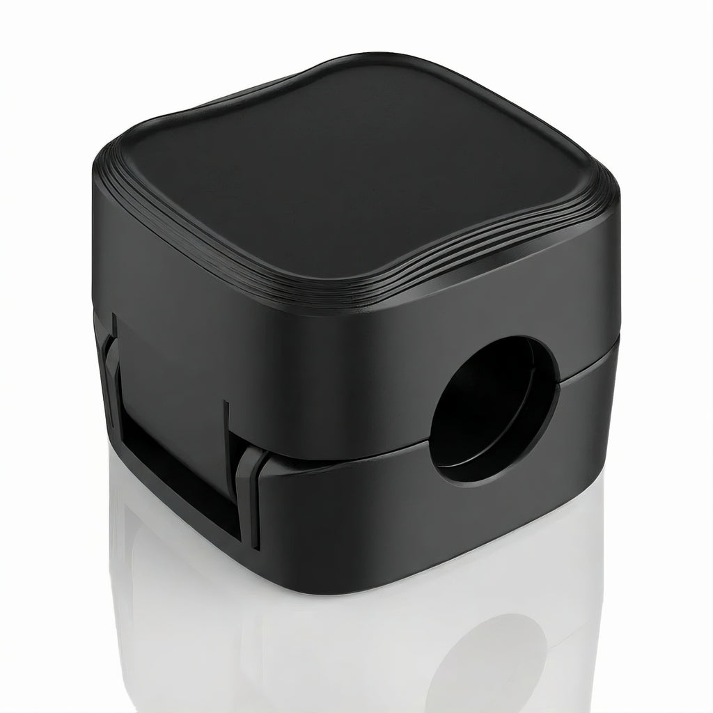 Single black magnetic cable management clip shown closed on a white background