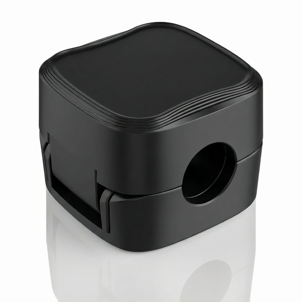 Single black magnetic cable management clip shown closed on a white background