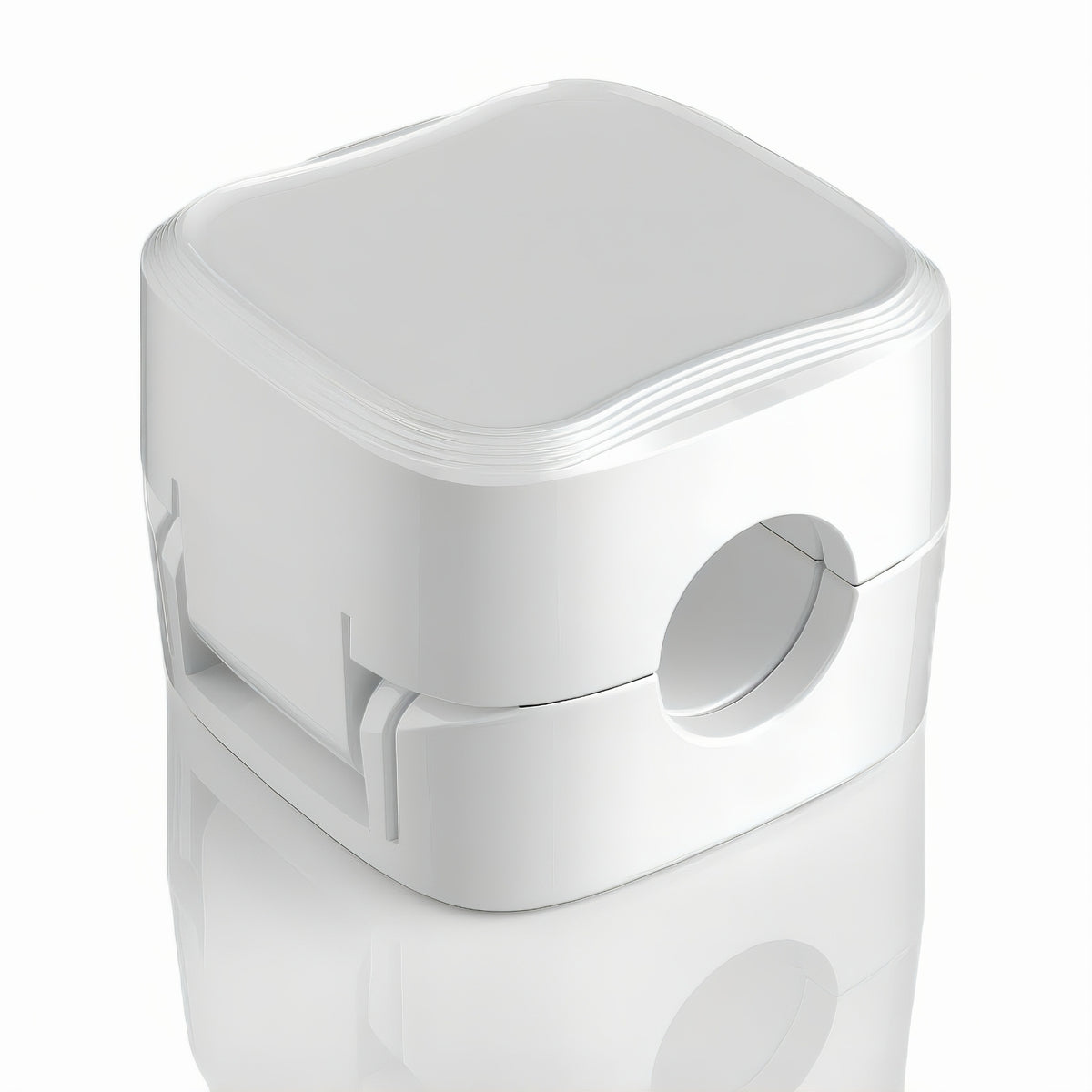 Single white magnetic cable management clip shown closed on a white background