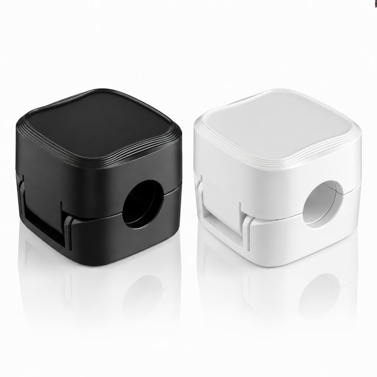 Black and white magnetic cable management clips side by side on white background
